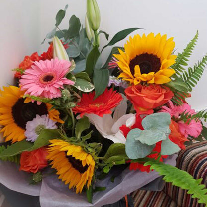 Florist Choice - Brights by ReCreation Flowers: a vibrant, handcrafted bouquet of sunflowers, gerberas, roses, lilies, ferns & eucalyptus—available for same-day delivery from your Leigh on Sea florist.