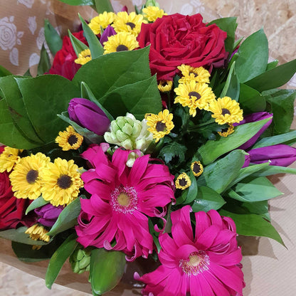 Florist Choice - Brights by ReCreation Flowers: a vibrant, florist-designed bouquet in brown floral paper, available with same-day delivery from your Leigh on Sea florist.