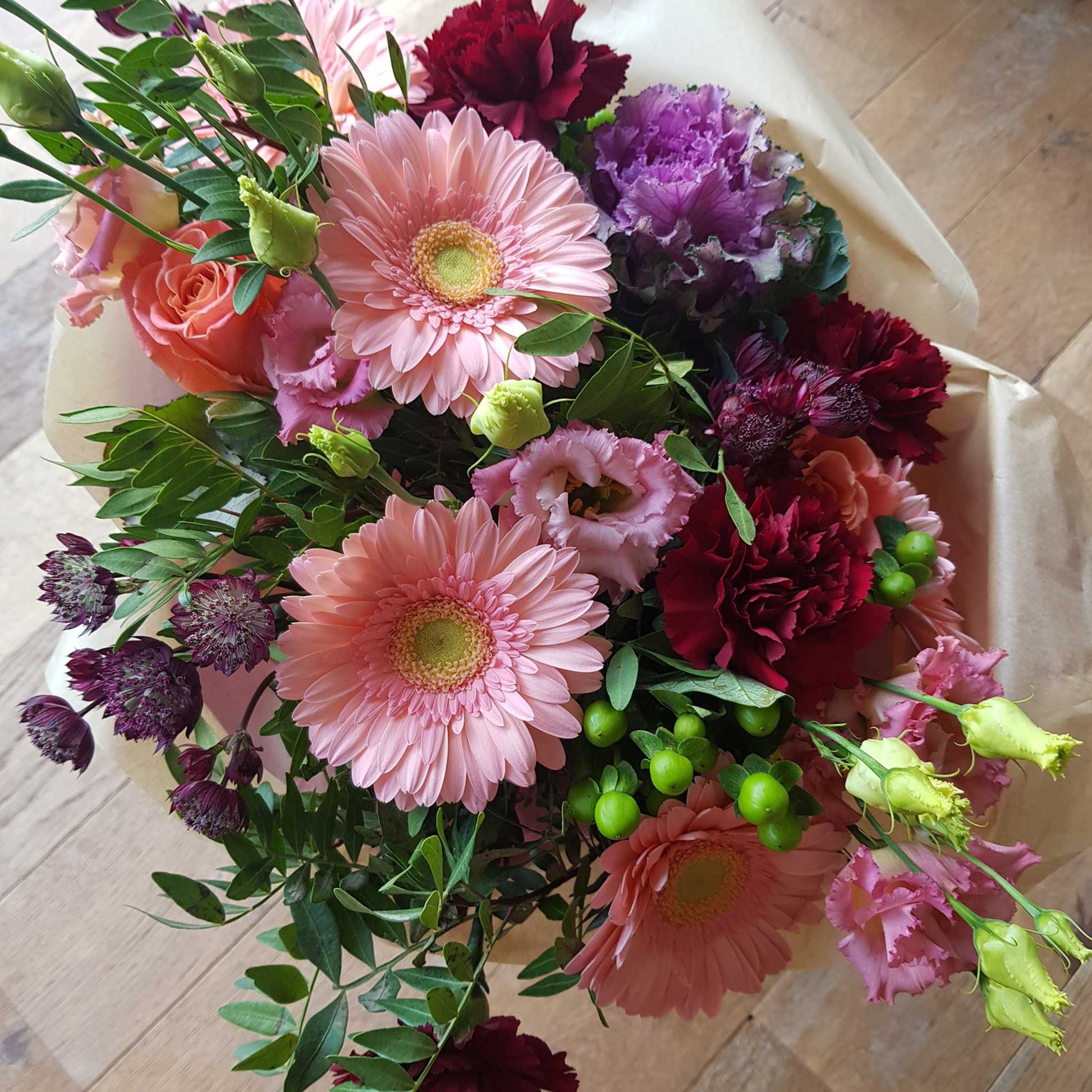 Florist Choice - Pastel by ReCreation Flowers: A bouquet of seasonal blooms in soft pastels, beautifully arranged with foliage and tissue paper by your trusted Leigh on Sea florist.