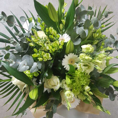 The Florist Choice - White & Green by ReCreation Flowers features white roses, lilies, gerberas, seasonal blooms, and greenery—expertly arranged by your Leigh on Sea florist with same-day delivery for any occasion.